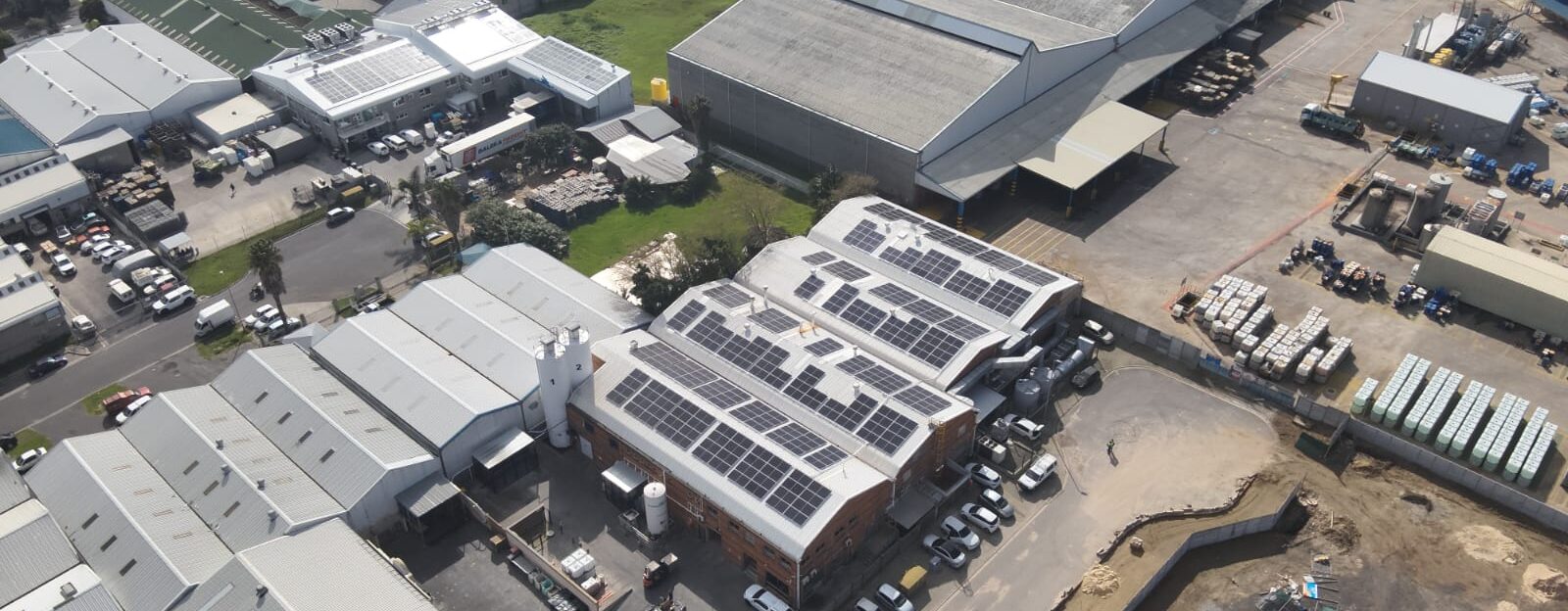 roof-mounted, grid-tied solar system with full generator integration at Amaro Foods plant in Epping in the Western Cape.